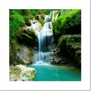 Waterfall over rocks into turquoise lake Posters and Art